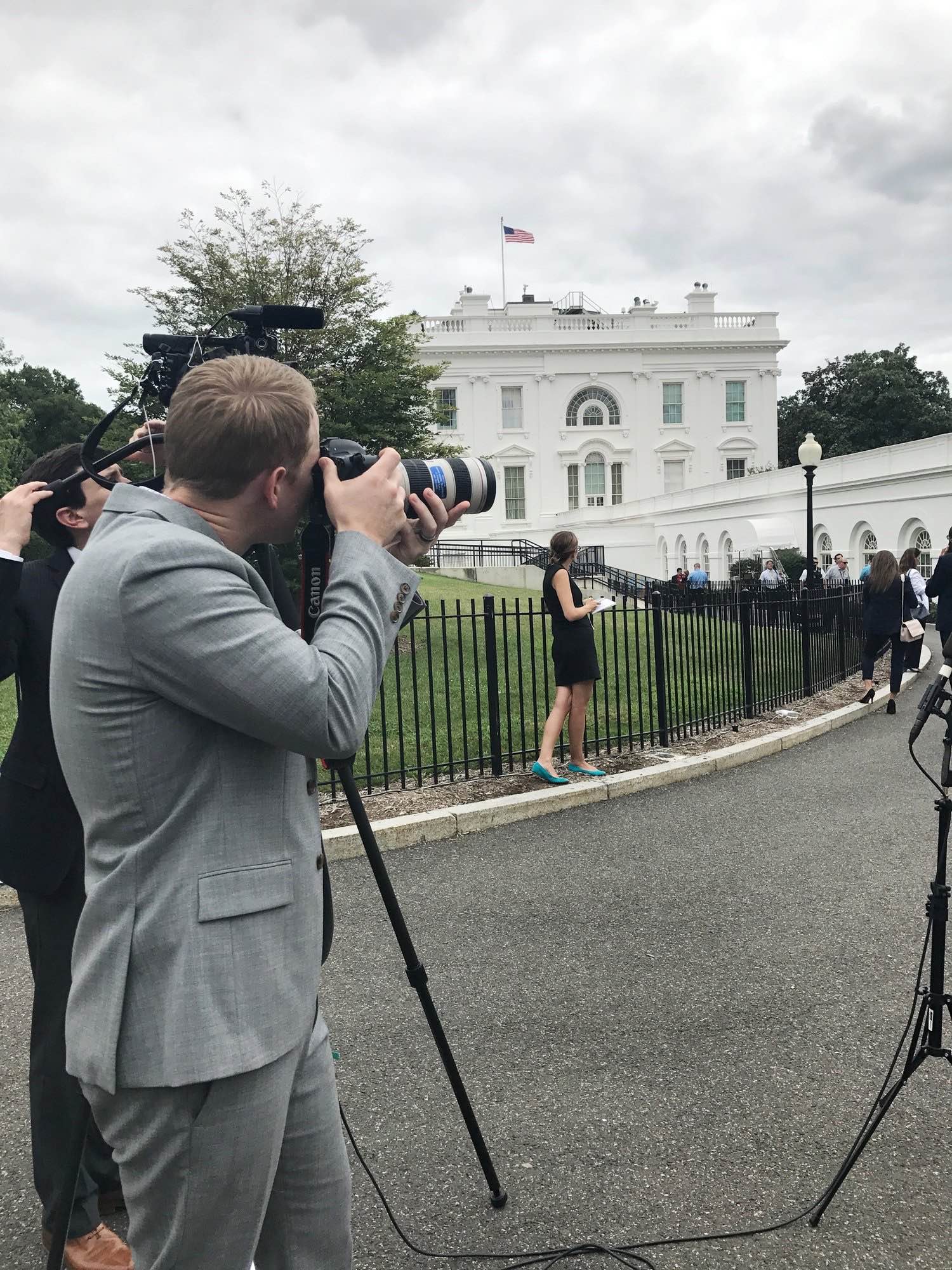 Evan Walker photographing a press event on the White House North Lawn